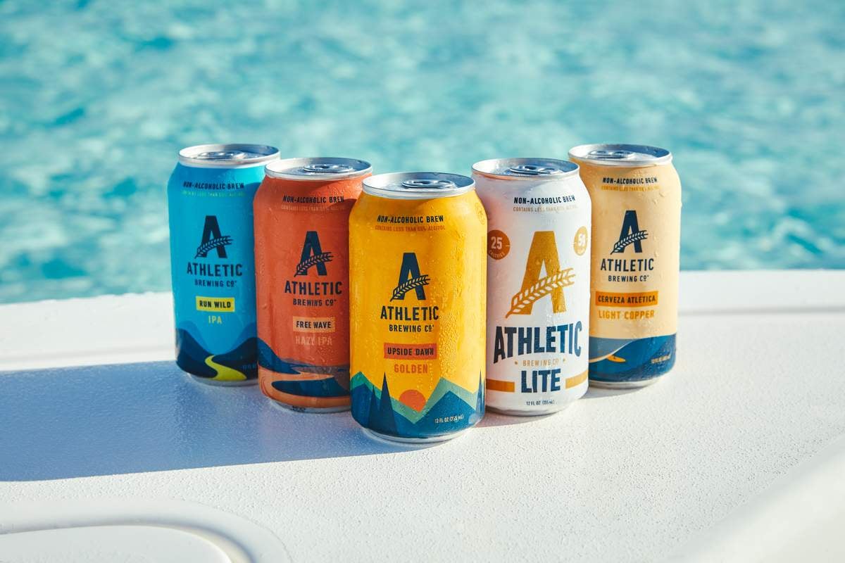 Athletic Brewing's beer lineup by the pool 