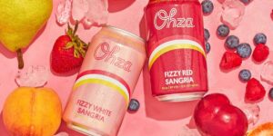 Ohzz Sangria in cans with fruit on the background rad yo