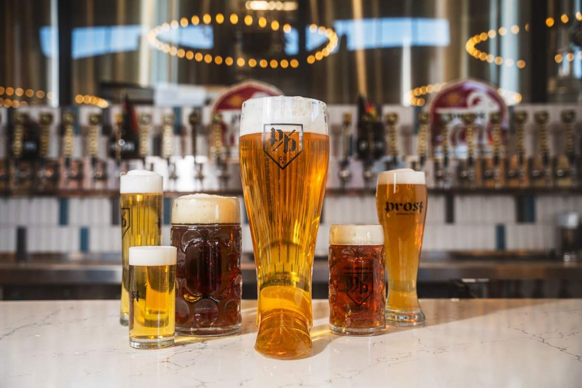 Prost Brewing beer in glasses at a bar