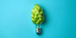 hop lightbulb blue background energy efficient green practices