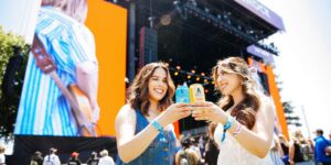 Athletic Brewing Live Nation partnership two women cheers at concert